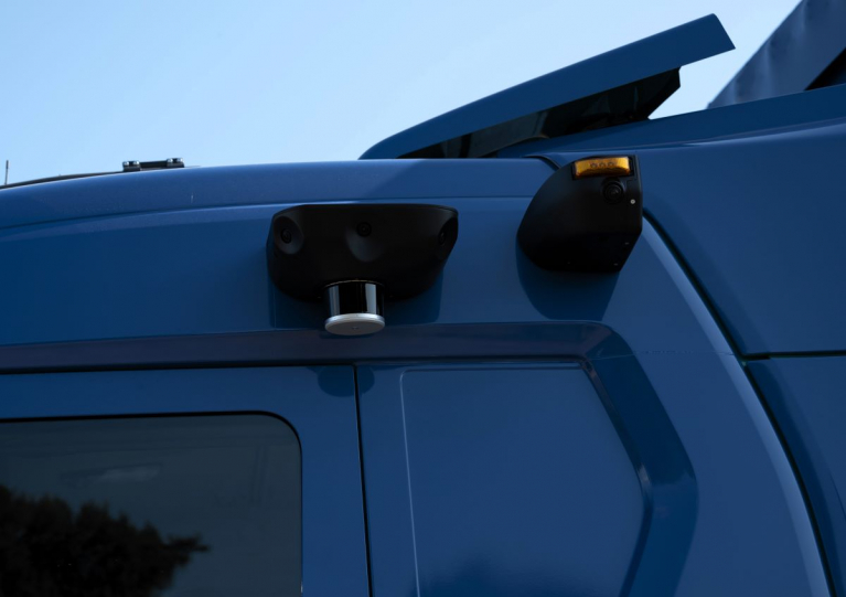 LIDAR sensors mounted on the side of the cab roof of a Scania autonomous truck.