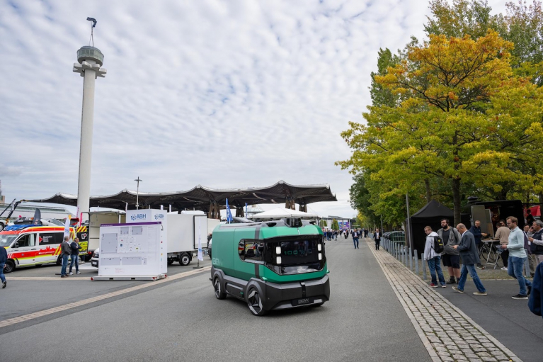 IAA TRANSPORTATION 2026 exhibition grounds in Hanover with commercial vehicles and visitors.