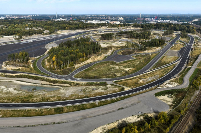 Aerial view of Scania’s R&D proving ground in Södertälje, with test roads and paved testing areas surrounded by woodland.