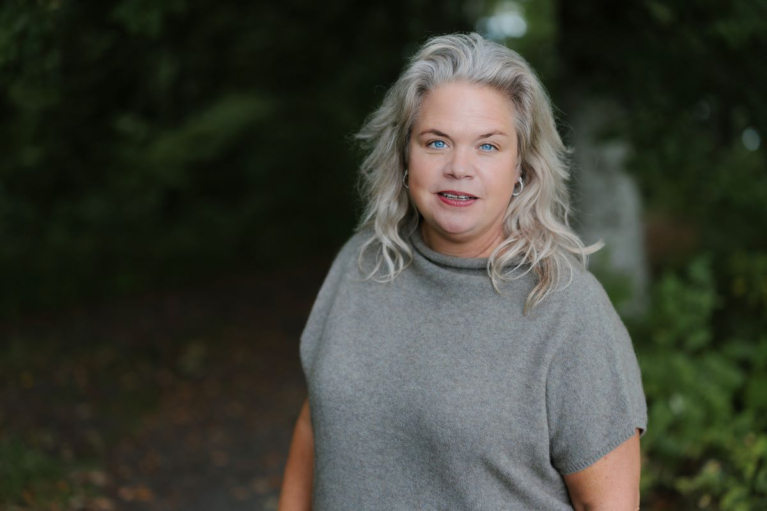 Lotta Lyrå, President and CEO of Södra, standing outdoors with trees in the background.