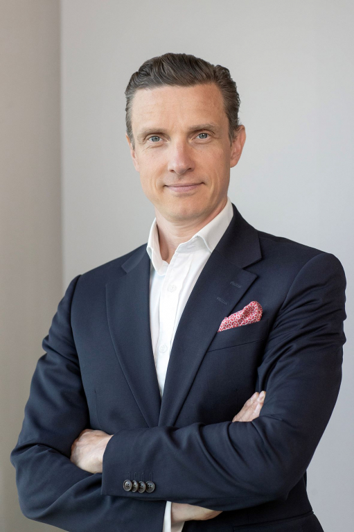 Harri Janhunen of UPM Adhesive Materials wearing a dark suit.